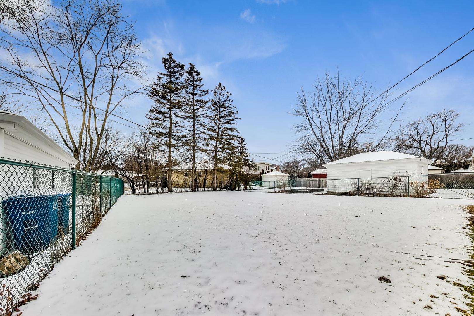 1022 Ridge Road Highland Park, IL 60035 - Photo 14 of 17 a street view covered with snow