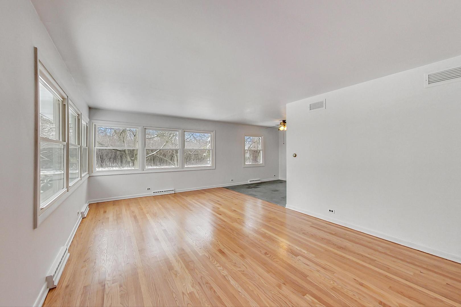 1022 Ridge Road Highland Park, IL 60035 - Photo 2 of 17 wooden floor in an empty room with a window