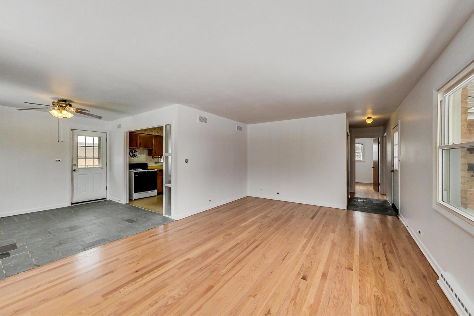 1022 Ridge Road Highland Park, IL 60035 - Photo 4 of 17 wooden floor in an empty room with a window