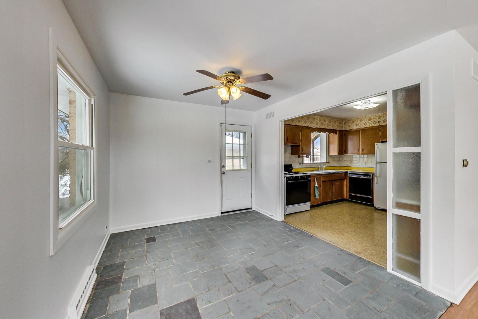 1022 Ridge Road Highland Park, IL 60035 - Photo 5 of 17 a view of an empty room with a kitchen