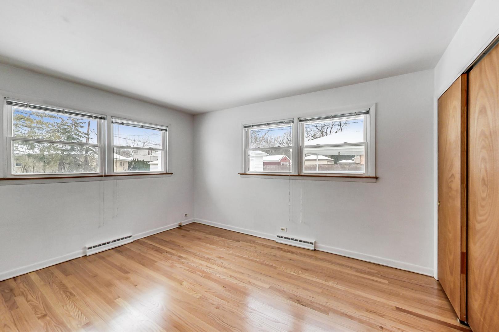 1022 Ridge Road Highland Park, IL 60035 - Photo 8 of 17 a view of empty room with wooden floor and fan