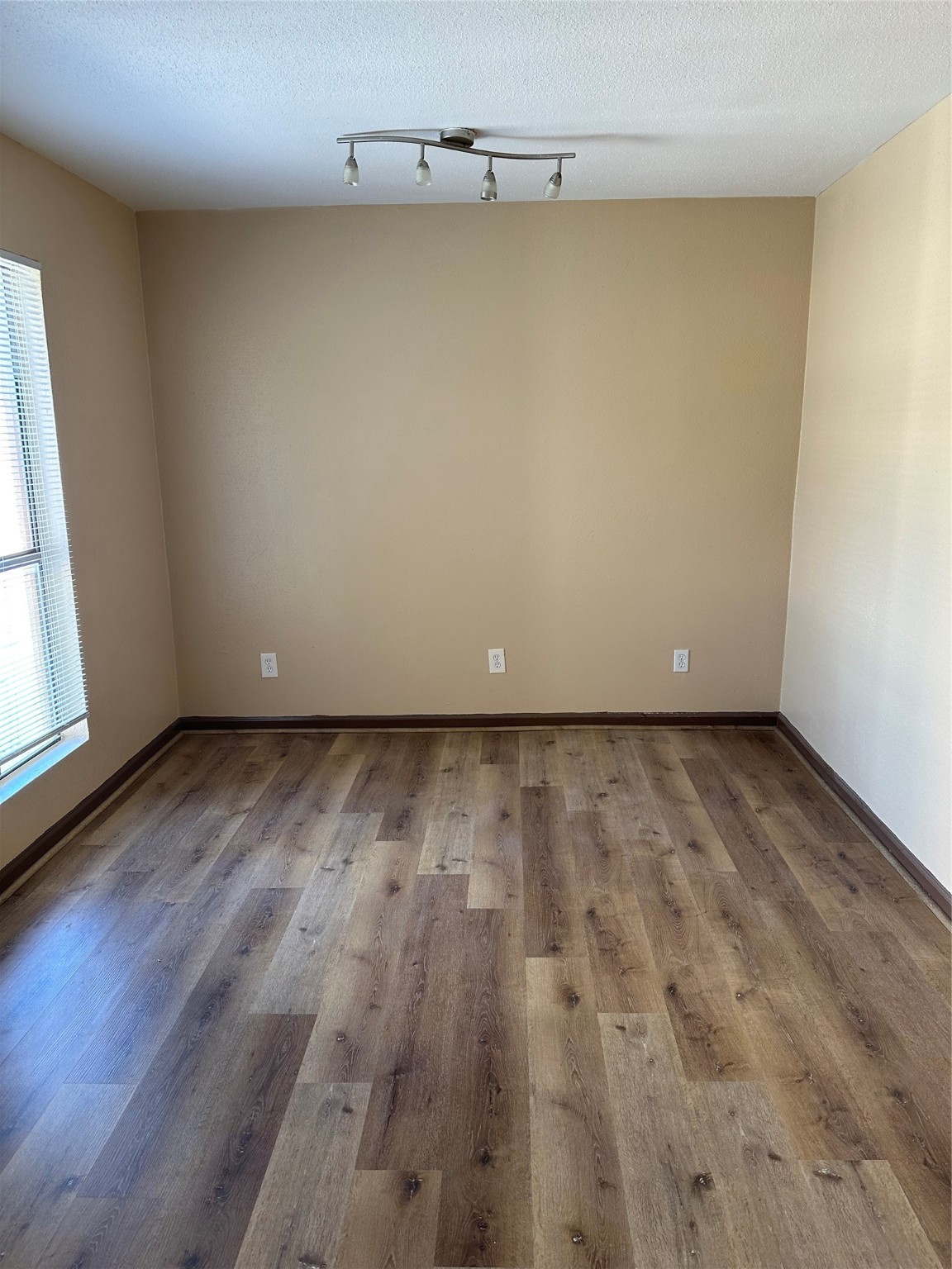10100 South Gessner Road, Unit 414 Houston, TX 77071 - Photo 9 of 13 a view of a room with wooden floor and a window