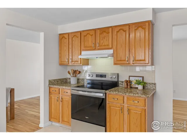 a kitchen with stainless steel appliances granite countertop a refrigerator sink and cabinets
