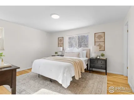 a bedroom with a bed and a potted plant