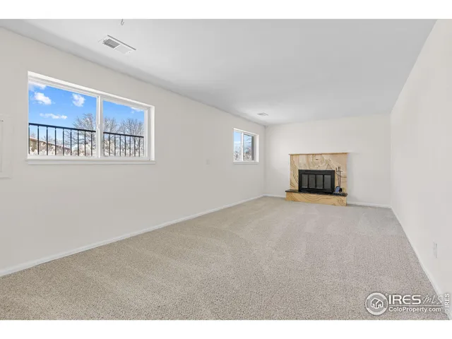 a living room with a fireplace