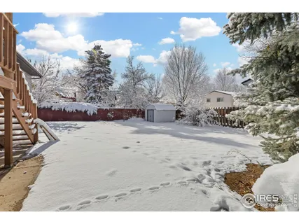 a view of a house with a snow in the yard