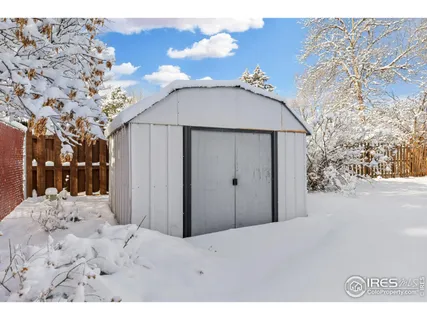 a picture of a bench in front of a wall
