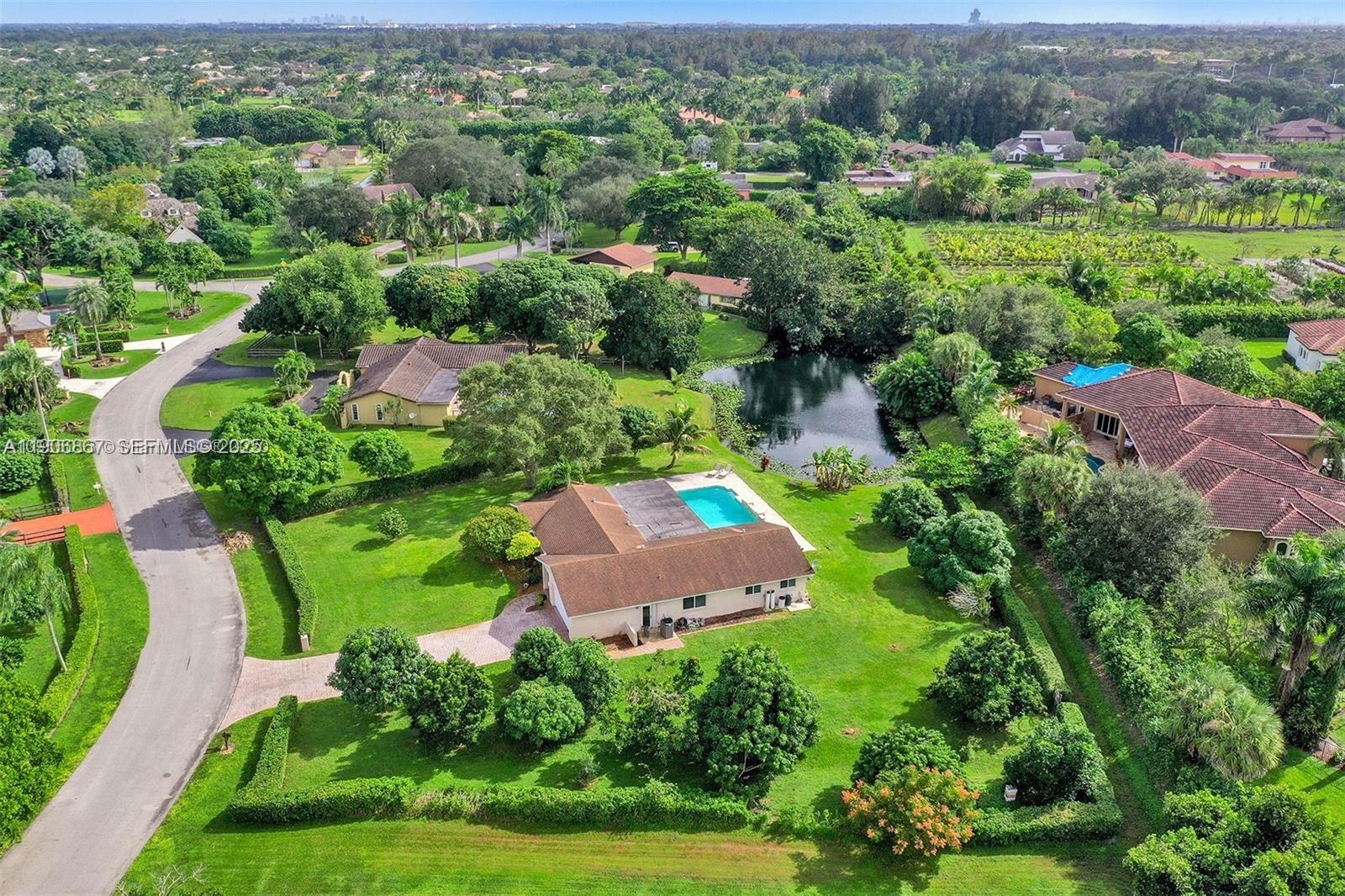 an aerial view of residential house with outdoor space and street view