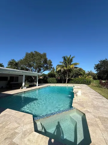 a view of a backyard with plants