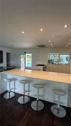 a room with lots of furniture and a chandelier