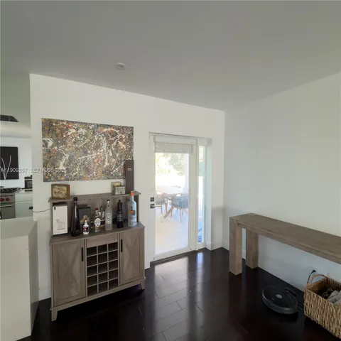 a living room with furniture fireplace and a window
