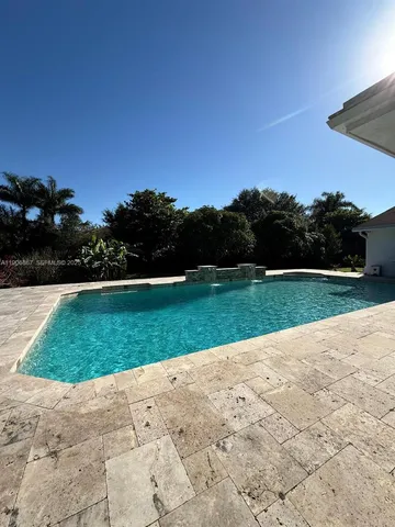a view of a golf course with a garden