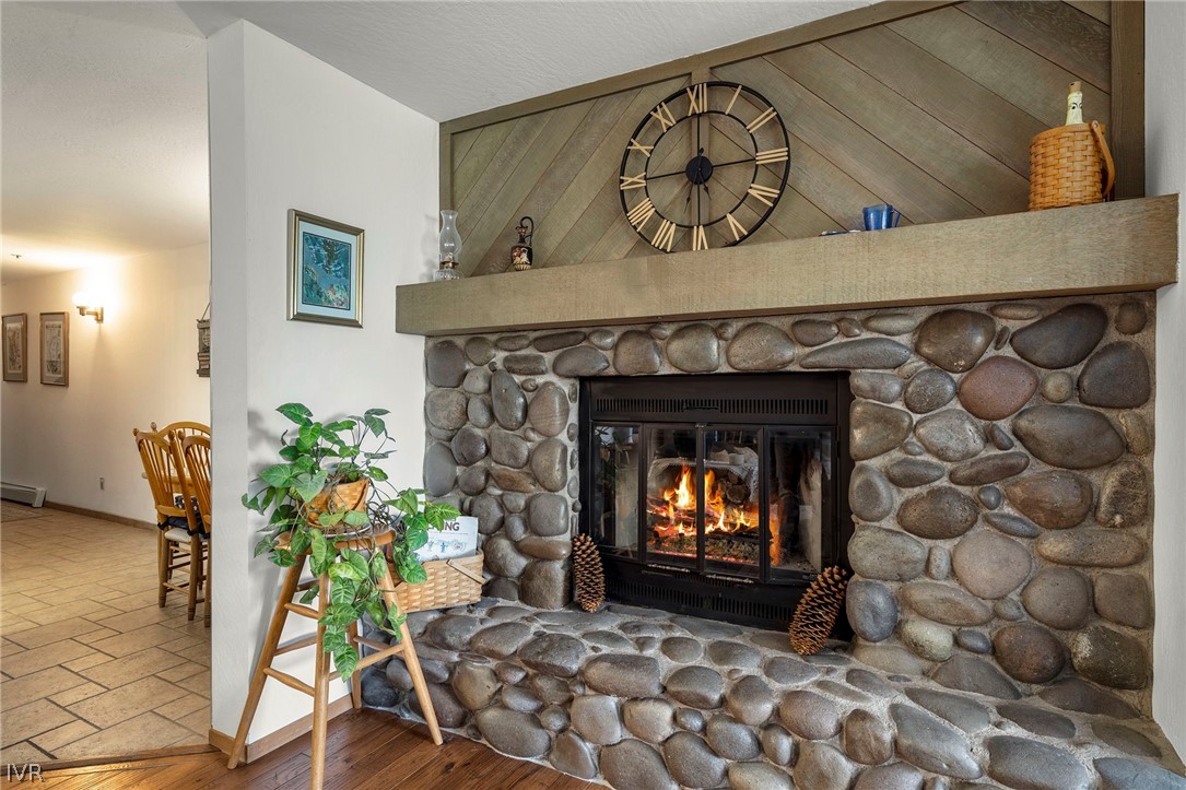 335 Ski Way, Unit 337 Incline Village, NV 89451 - Photo 16 of 23 a view of a fireplace with window and wooden floor