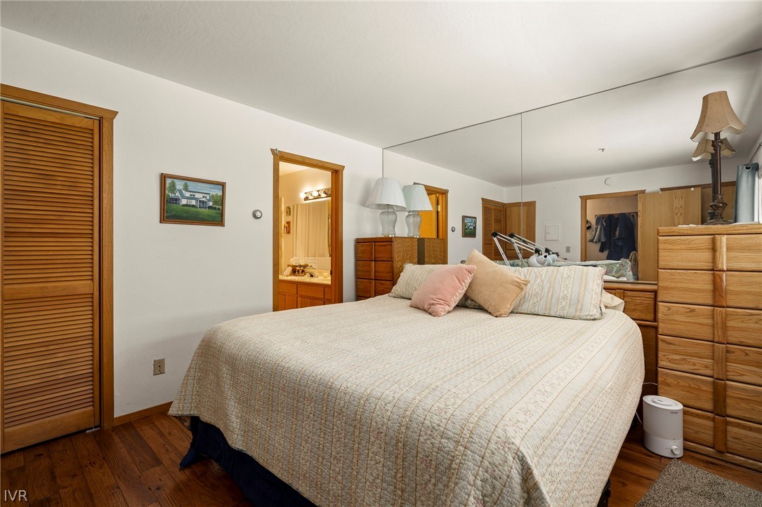 335 Ski Way, Unit 337 Incline Village, NV 89451 - Photo 17 of 23 a large bedroom with a bed and wooden floor