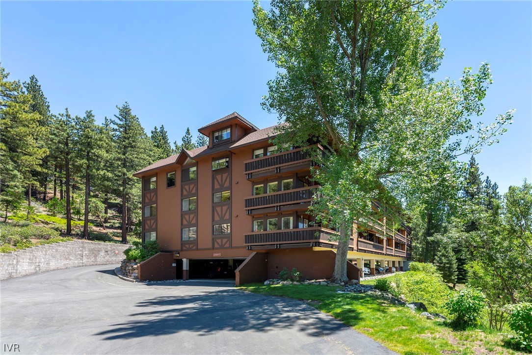 335 Ski Way, Unit 337 Incline Village, NV 89451 - Photo 4 of 23 a front view of a house with garden and trees
