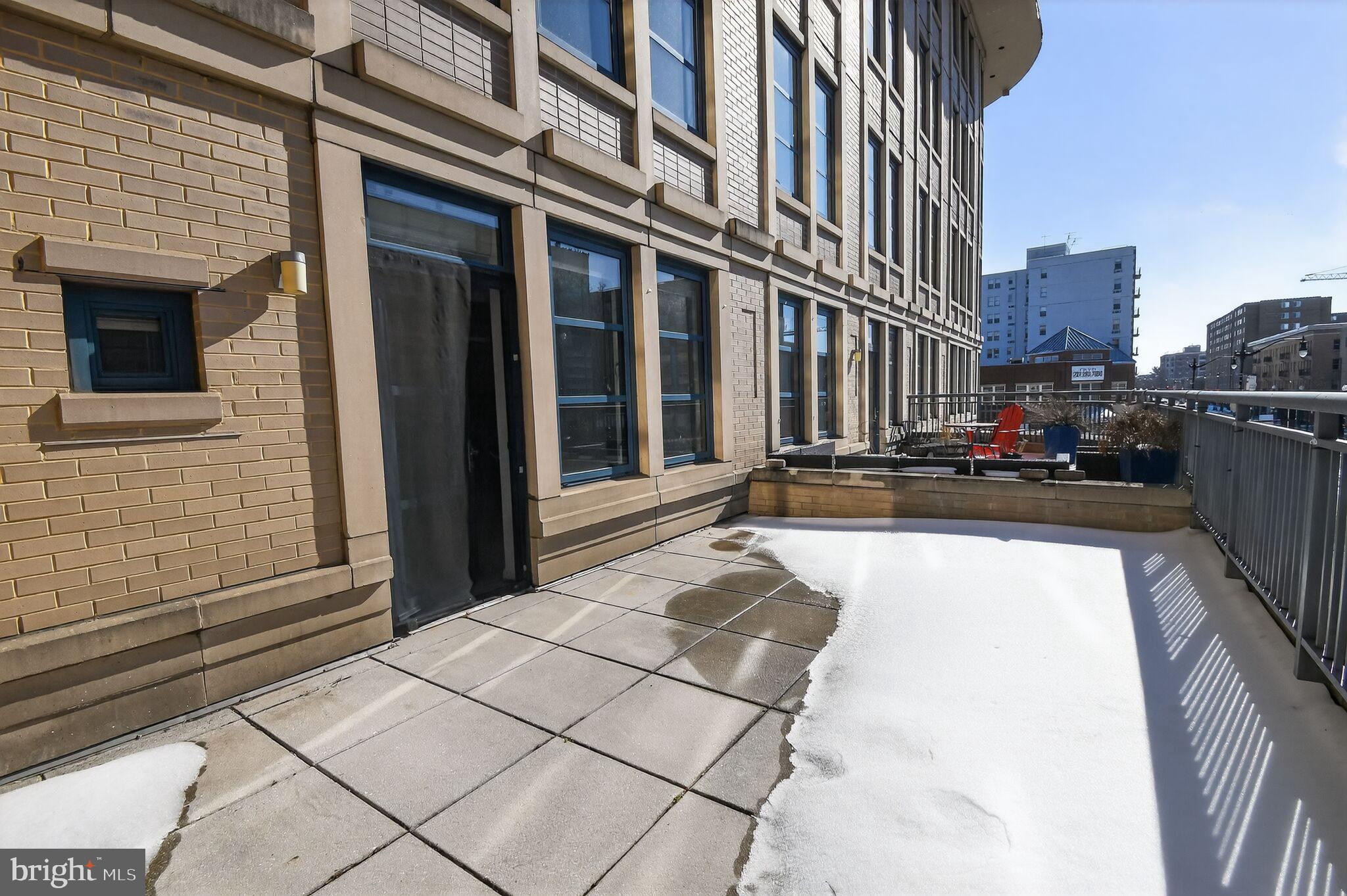 1390 Kenyon Street Northwest, Unit 319 Washington, DC 20010 - Photo 18 of 38 a view of a building with car parked