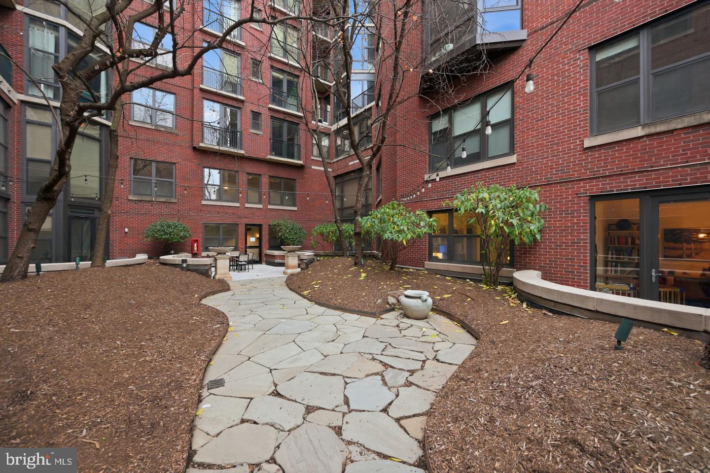 1390 Kenyon Street Northwest, Unit 319 Washington, DC 20010 - Photo 30 of 38 a view of a building with potted plants