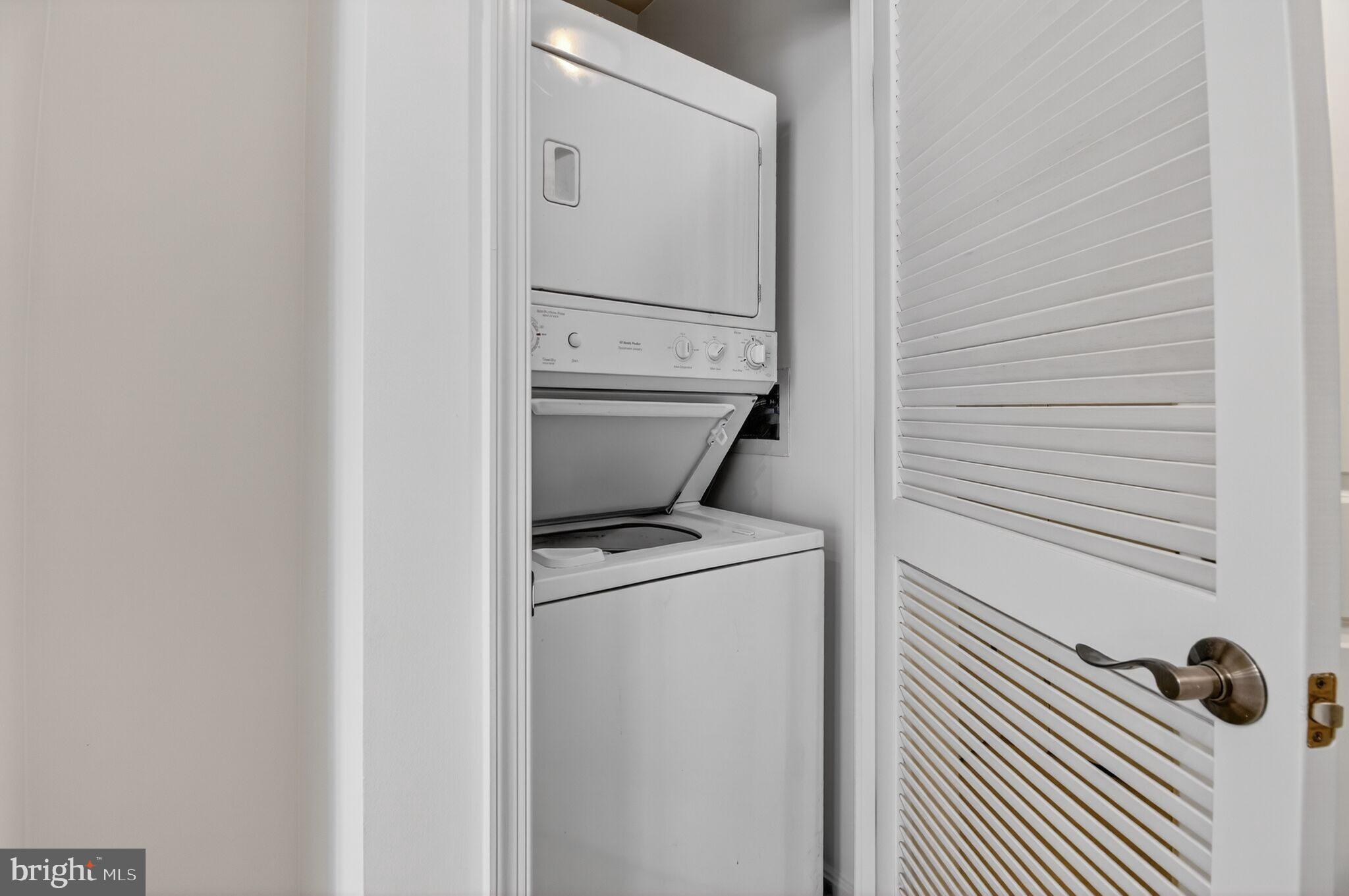 1390 Kenyon Street Northwest, Unit 319 Washington, DC 20010 - Photo 7 of 38 a utility room with dryer and washer