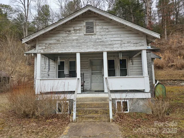 a front view of a house with glass windows