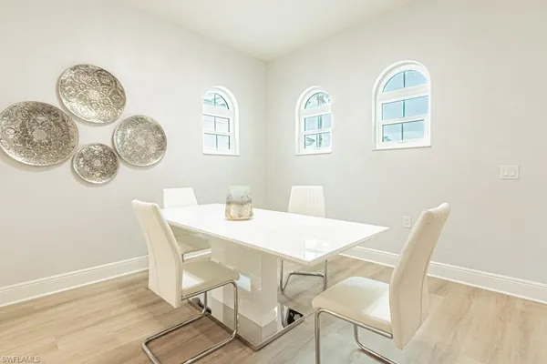 a view of a dining room with furniture and a table