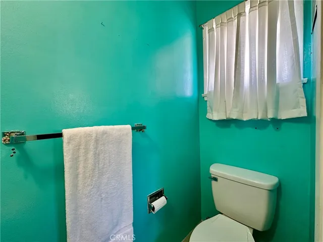 a bathroom with a toilet and a sink