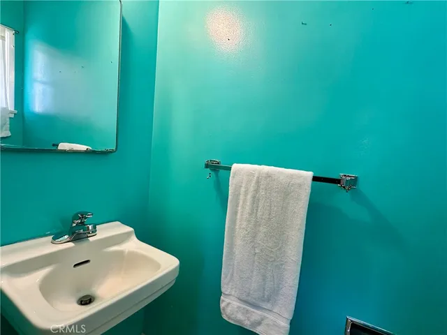 a bathroom with a sink and mirror