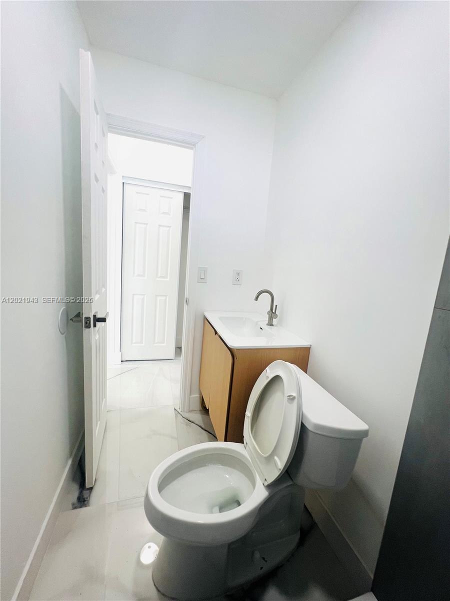 15530 Southwest 295th Terrace Homestead, FL 33033 - Photo 10 of 14 a bathroom with a toilet and a sink