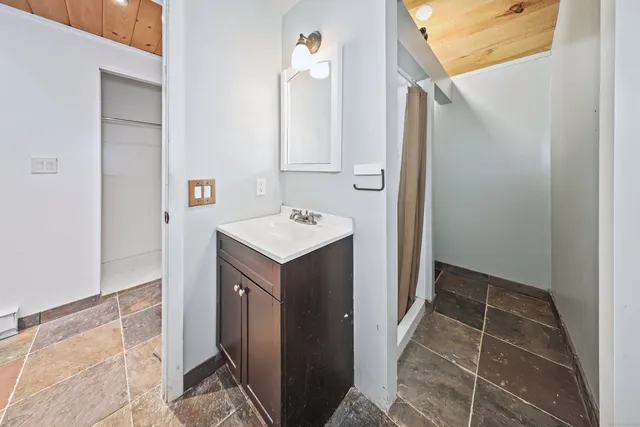 a bathroom with a sink and a mirror