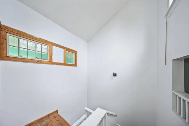 a view of a hallway with staircase