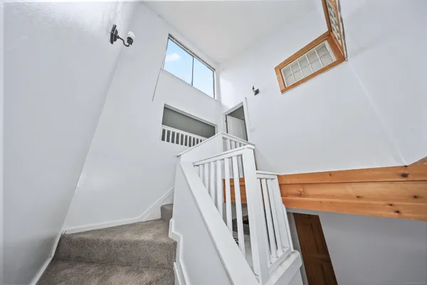 a backyard of a house with outdoor seating