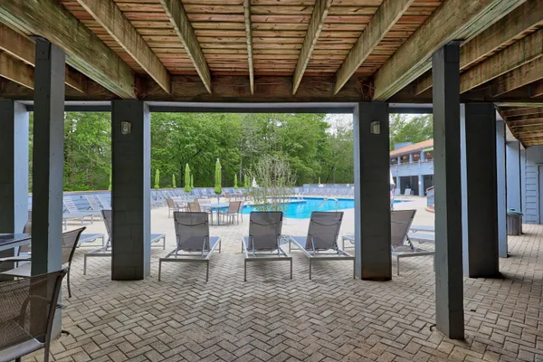 a view of a backyard with table and chairs