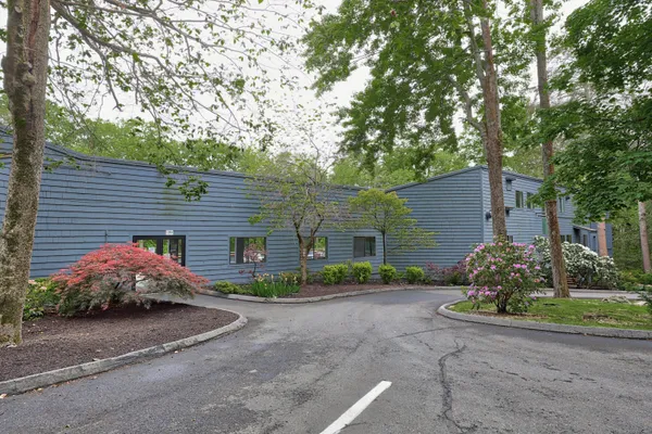 a wooden bench sitting next to a lake