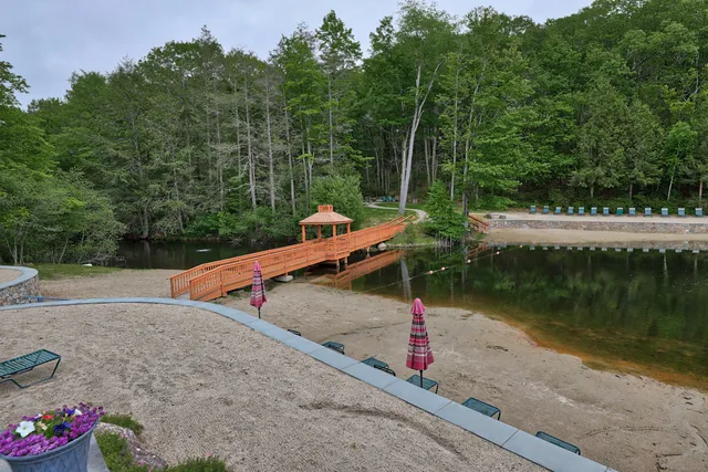 a view of a patio with a table chairs and a backyard