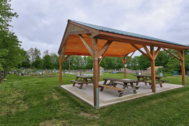 a house view with a play ground in front of it