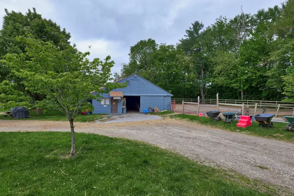 a front view of a building with garden