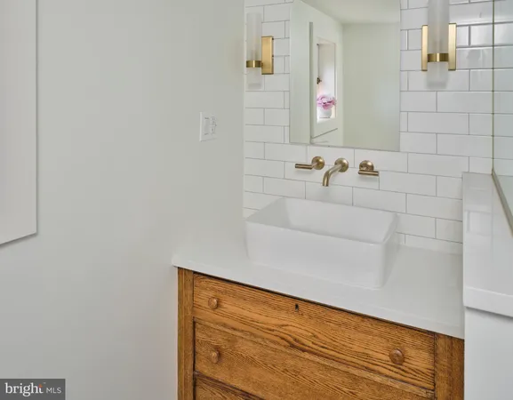 a bathroom with a bathtub and a sink