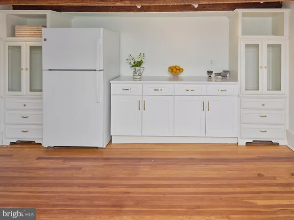 a view of kitchen with wooden floor
