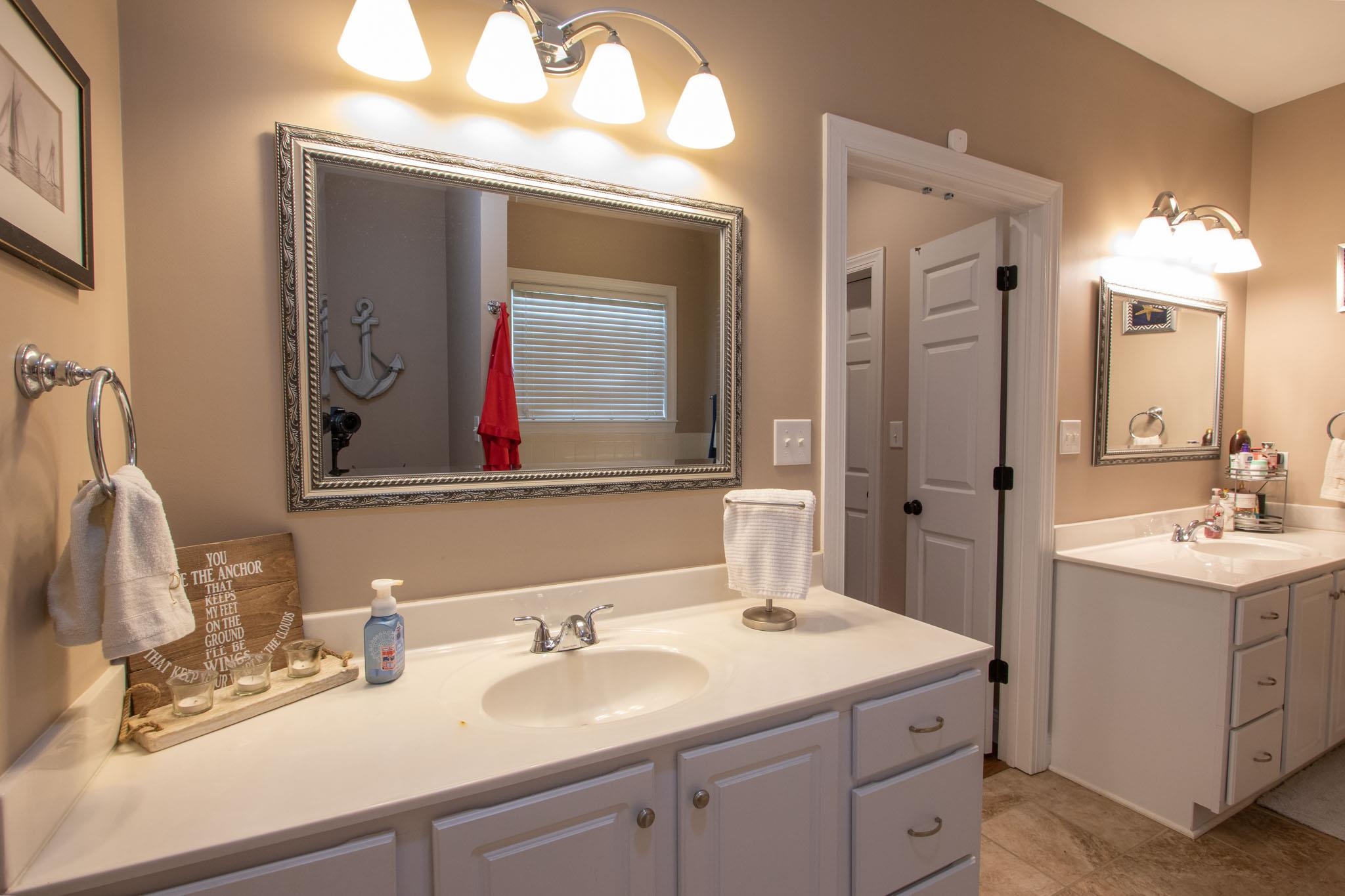 152 Waterfront Drive Raphine, VA 24472 - Photo 30 of 49 a bathroom with a double vanity sink mirror and double