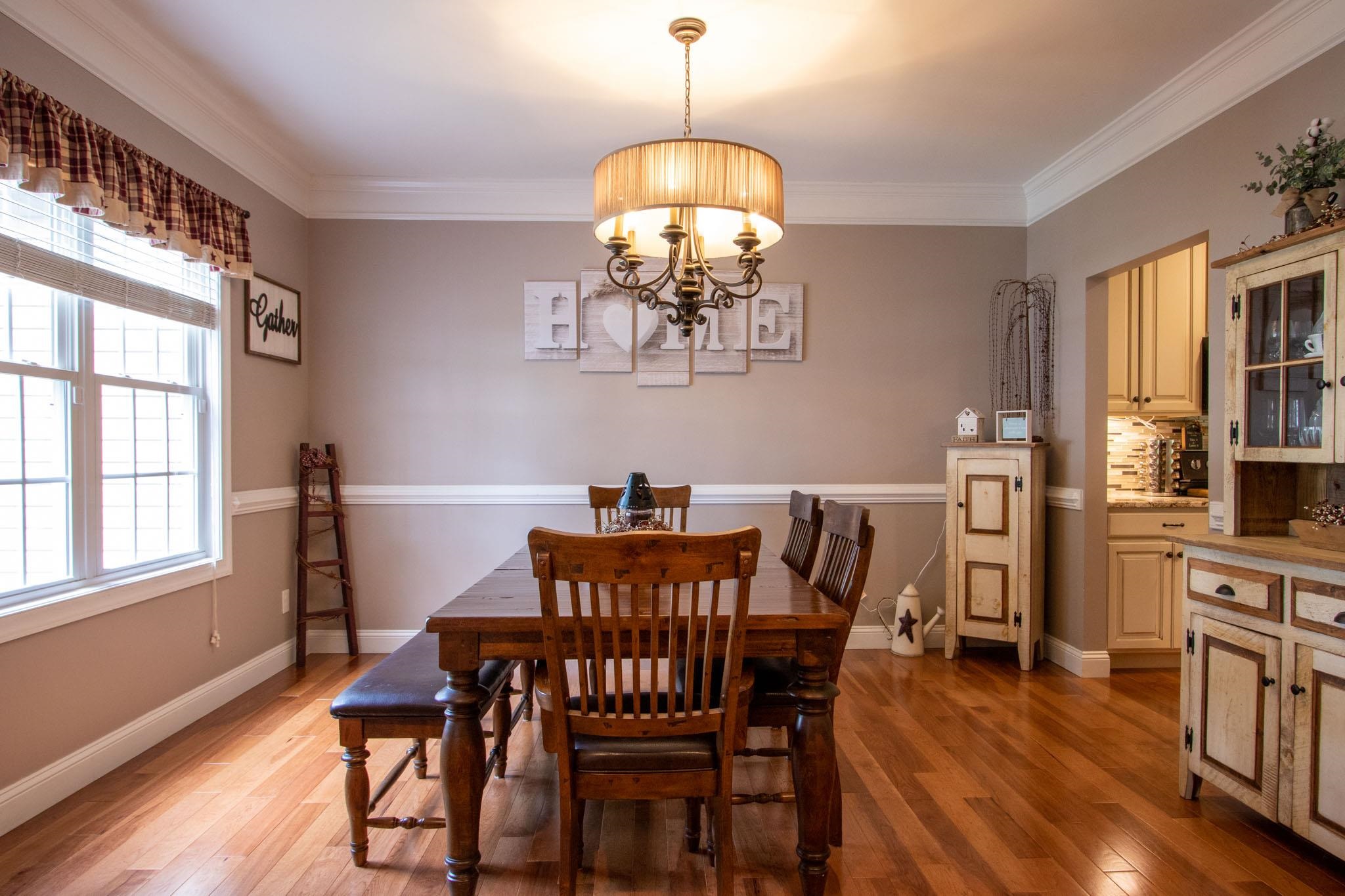 152 Waterfront Drive Raphine, VA 24472 - Photo 10 of 49 a view of a dining room with furniture wooden floor and chandelier