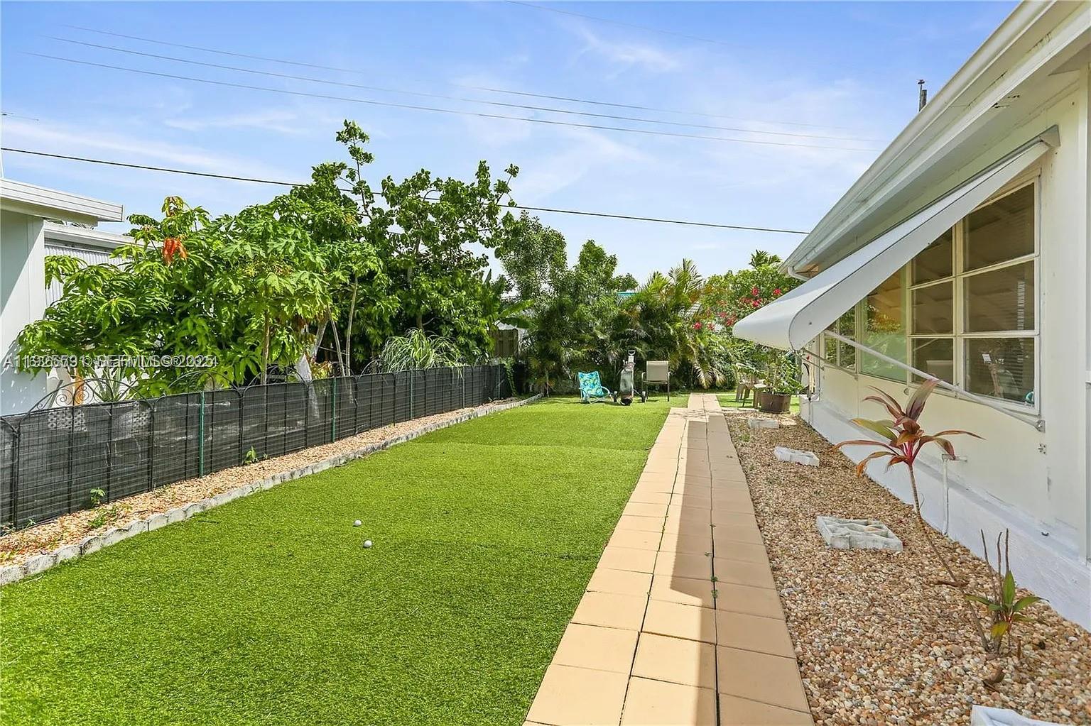 8616 Southwest 16th Place Davie, FL 33324 - Photo 18 of 21 a view of a backyard with sitting area