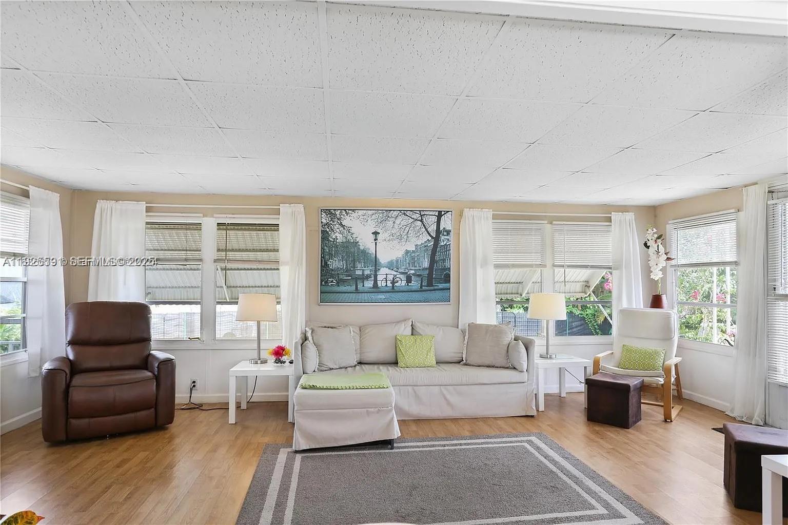 8616 Southwest 16th Place Davie, FL 33324 - Photo 6 of 21 a living room with furniture and a large window