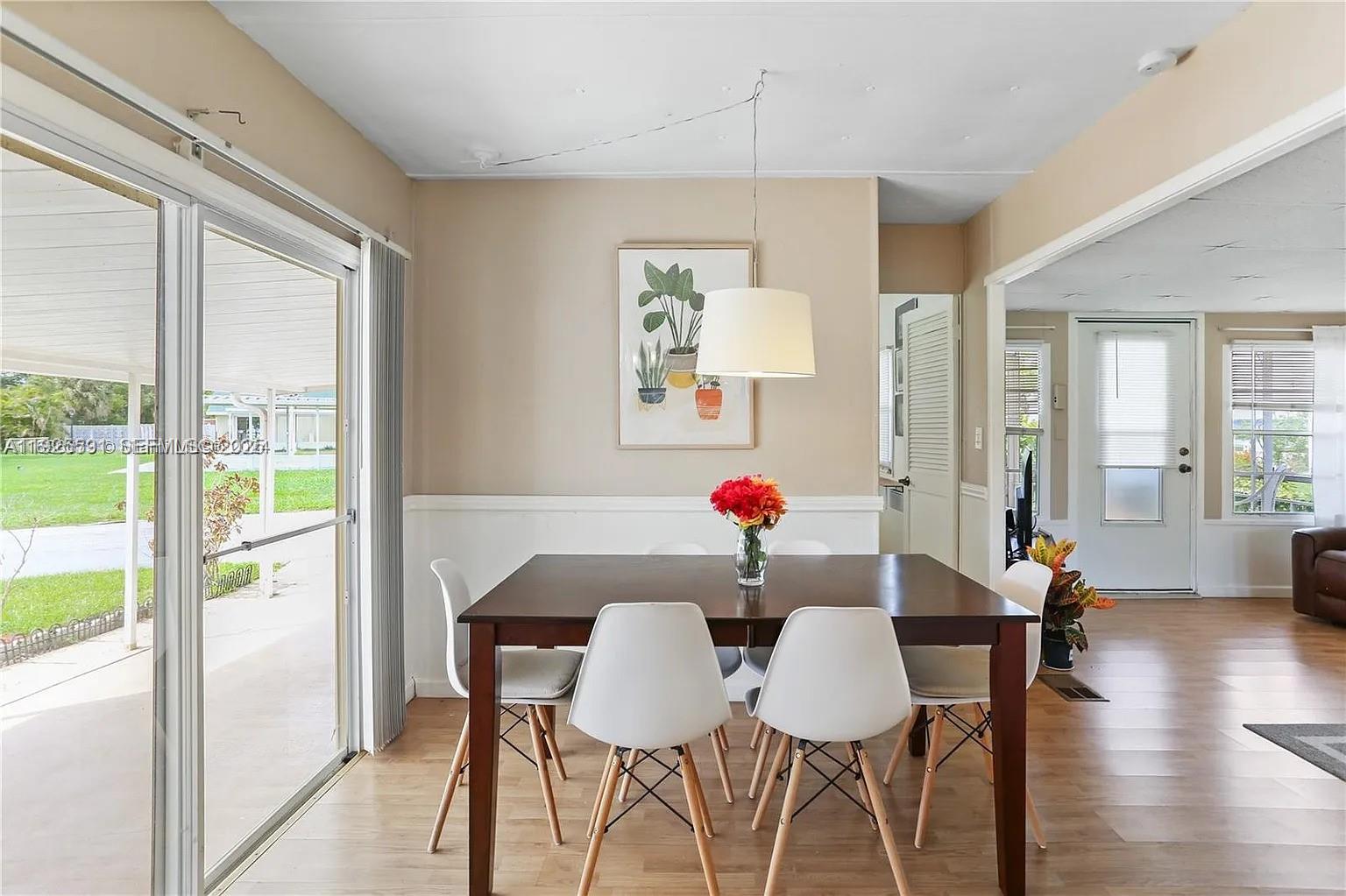 8616 Southwest 16th Place Davie, FL 33324 - Photo 8 of 21 a view of a dining room with furniture and wooden floor