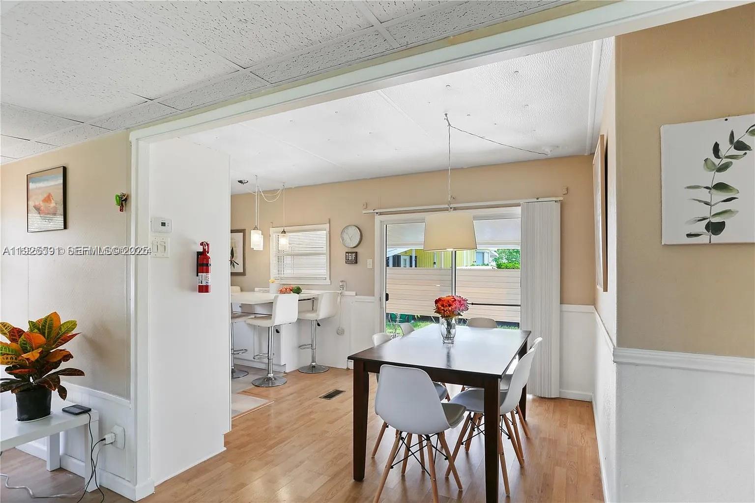 8616 Southwest 16th Place Davie, FL 33324 - Photo 9 of 21 a view of a dining room with furniture window and outside view