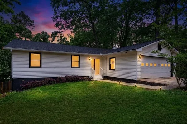 a backyard of a house with lots of green space