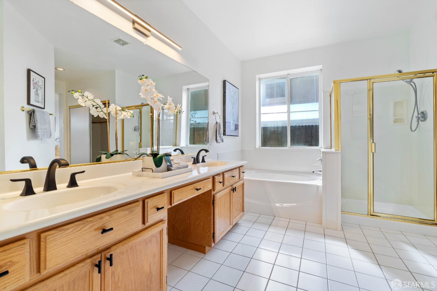 2626 Orange Way Antioch, CA 94531 - Photo 18 of 56 a spacious bathroom with a granite countertop sink mirror and bathtub