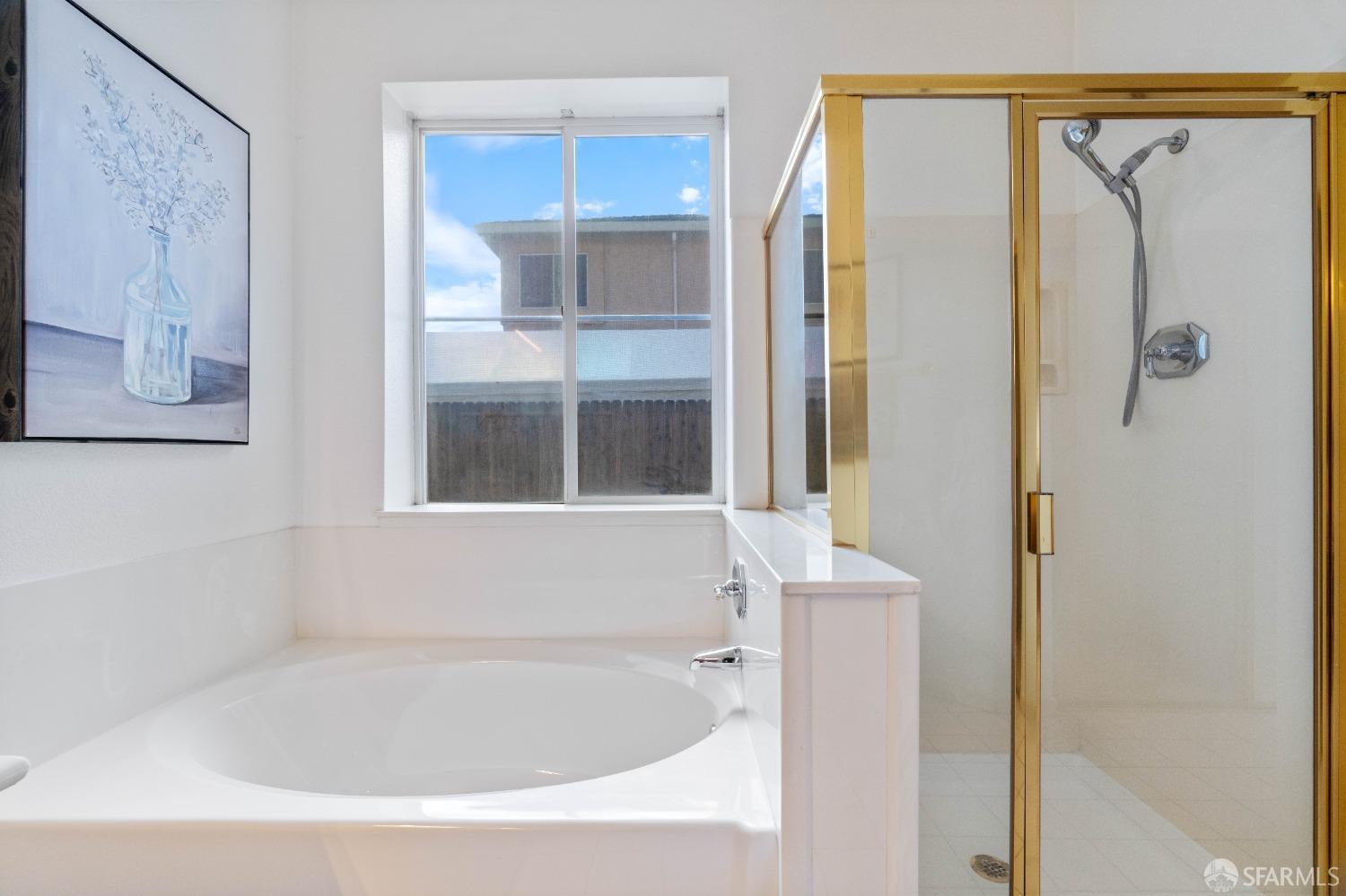 2626 Orange Way Antioch, CA 94531 - Photo 19 of 56 a bathroom with a bathtub and a shower