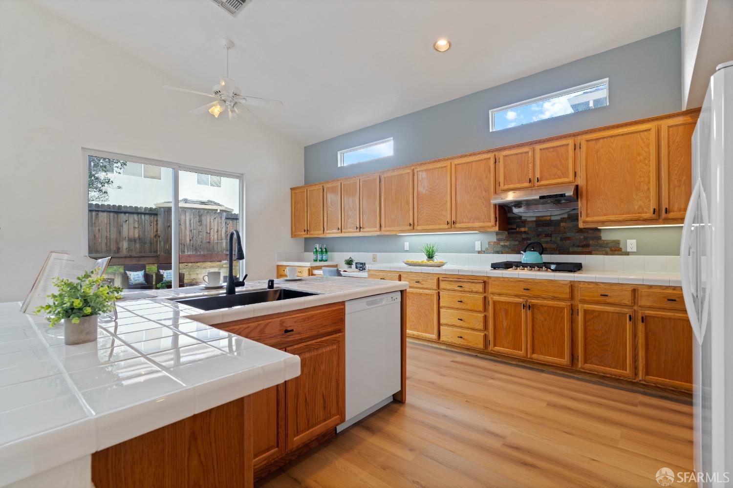 2626 Orange Way Antioch, CA 94531 - Photo 6 of 56 a kitchen with stainless steel appliances granite countertop a stove a sink and a refrigerator