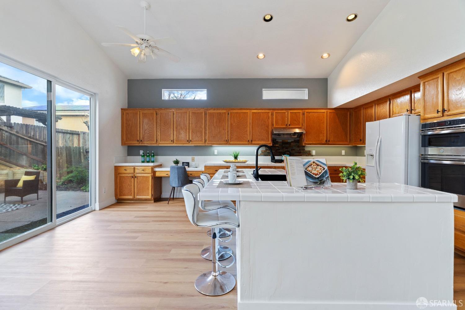 2626 Orange Way Antioch, CA 94531 - Photo 8 of 56 a kitchen with stainless steel appliances a refrigerator a sink a stove a dining table and chairs