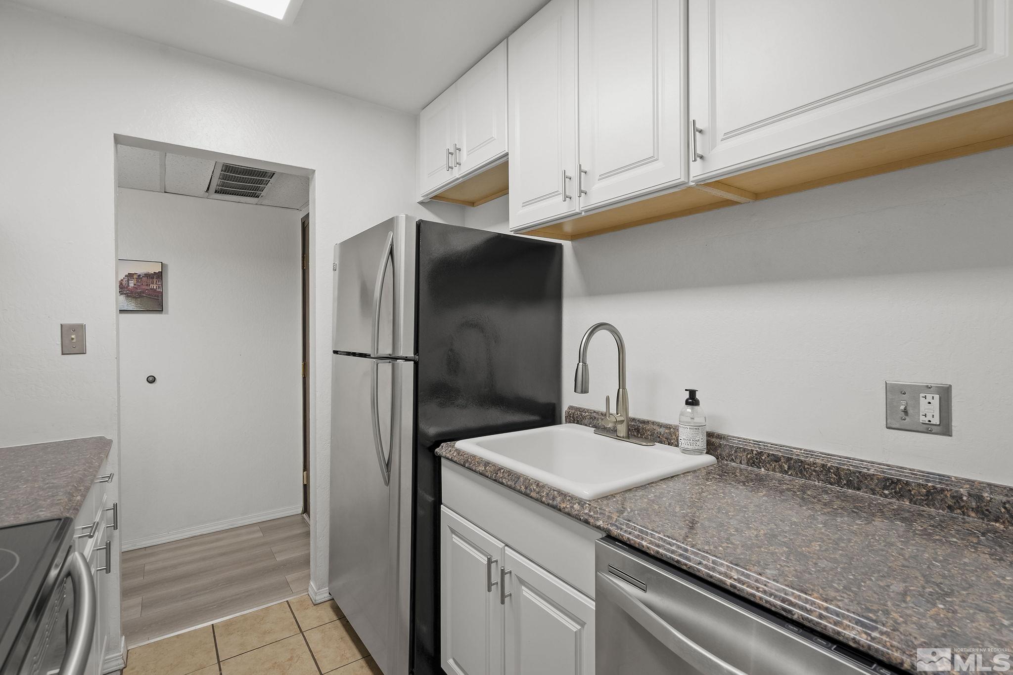 1000 Beck Drive, Unit 170 Reno, NV 89509 - Photo 13 of 23 a kitchen with a sink and refrigerator
