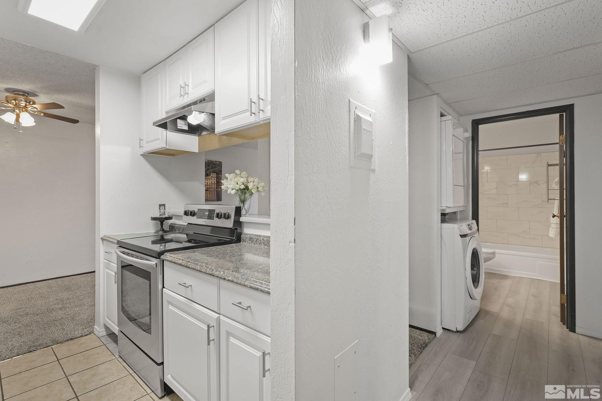 1000 Beck Drive, Unit 170 Reno, NV 89509 - Photo 14 of 23 a kitchen with stainless steel appliances granite countertop a sink and a refrigerator